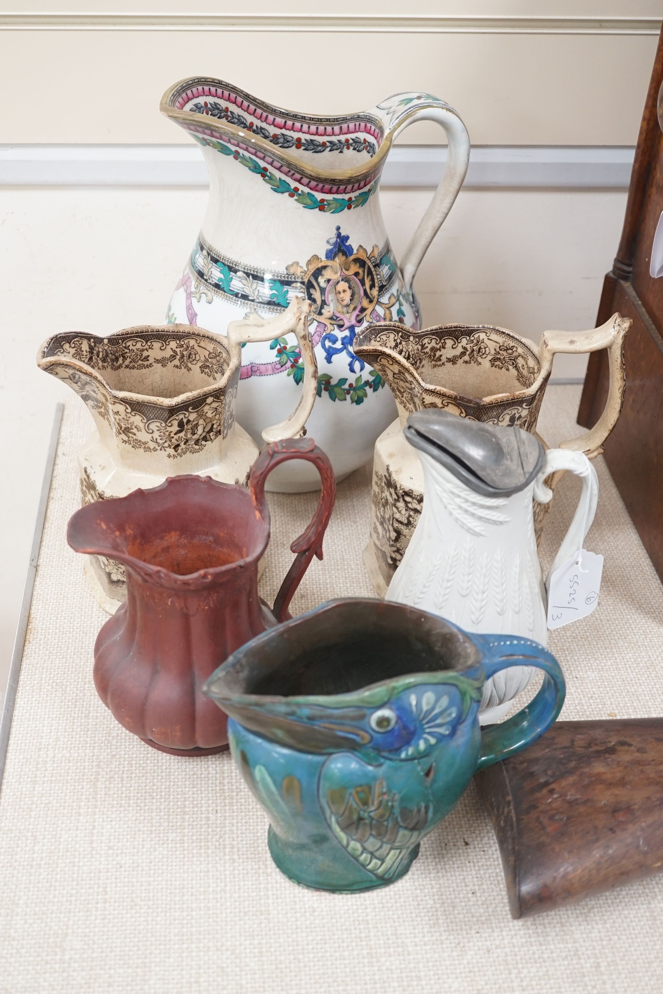 Six Victorian and later pottery jugs - tallest 29cm